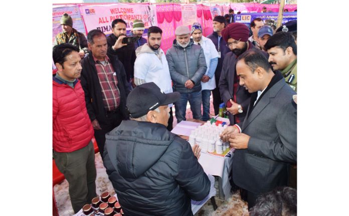 Div Com Ramesh Kumar inspecting stalls during Winter Festival at Lal Draman on Saturday.