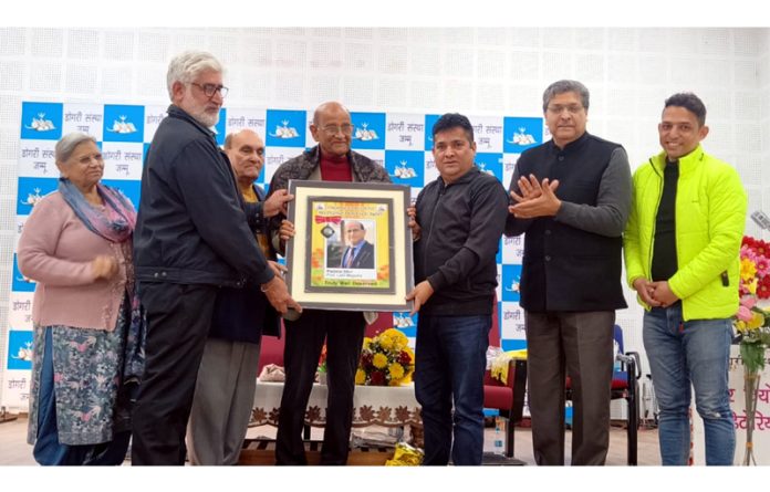 Dogri Sanstha honouring Prof Lalit Magotra during its Foundation Day function on Sunday.
