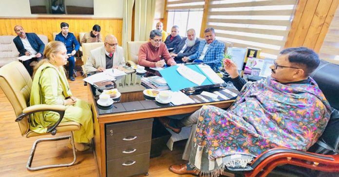 Forest Minister chairing a meeting on Monday.