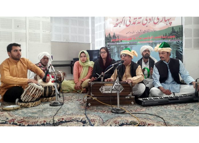 Artists giving musical performance during Pahari Literary and Cultural Conference in Jammu.