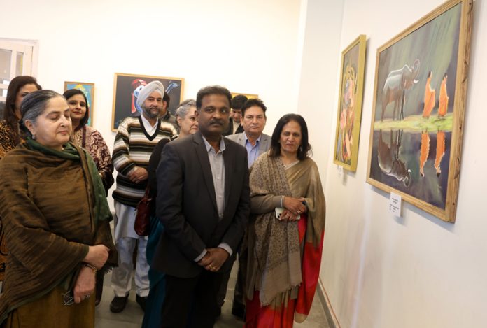 Dignitaries watching paintings at an exhibition in Jammu on Saturday. -Excelsior/Rakesh