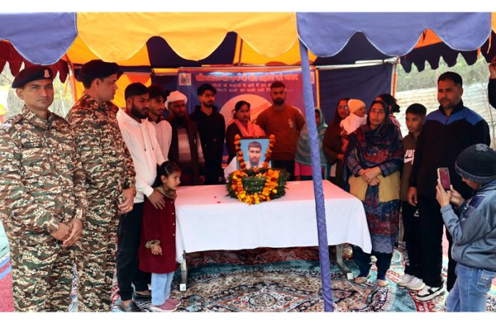 CRPF officers and locals paying tribute to martyr Mushtaq Ahmad in Ramban on Sunday.