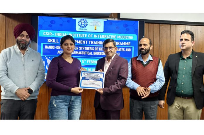 Director, CSIR-IIIM Jammu presenting certificate to one of the participants of training programme.