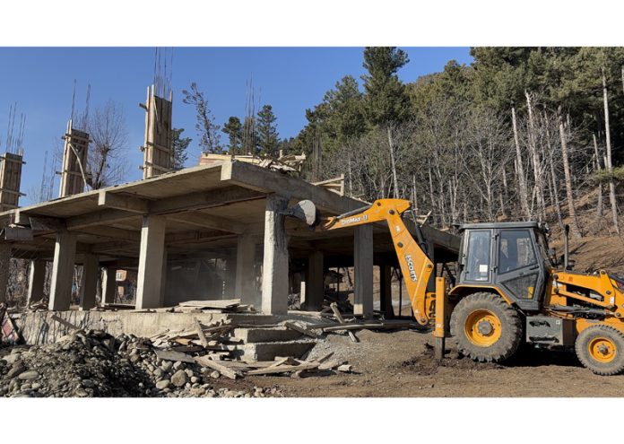 Demolition drive being conducted in Pahalgam.