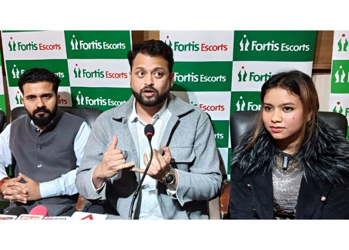 Dr Tapish Shukla from Fortis Escorts Amritsar along with a teen footballer on whom he performed ACL surgery. -Excelsior/Rakesh