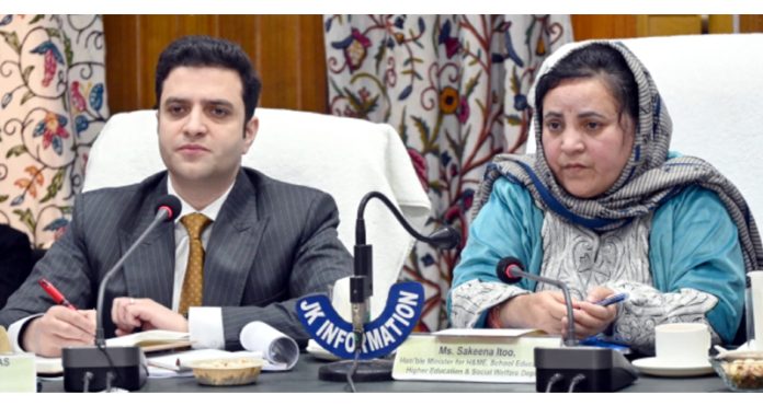 Minister Sakeena Itoo chairing a meeting at Kulgam on Friday.