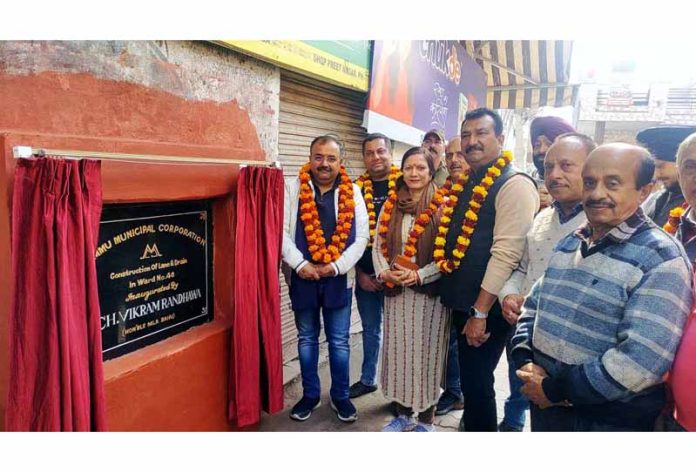 MLA Vikram Randhawa inaugurating work of lanes and drains in Jammu on Monday.