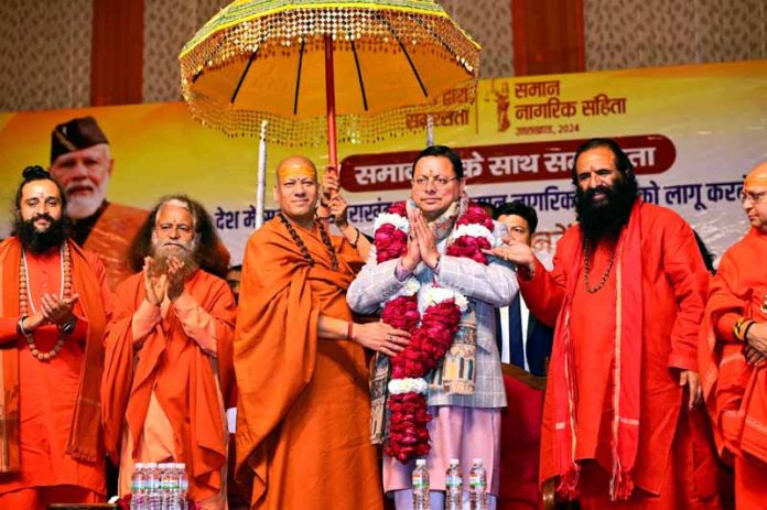 CM Pushkar Singh Dhami being felicitated by saints during a function in Prayagraj on Monday.
