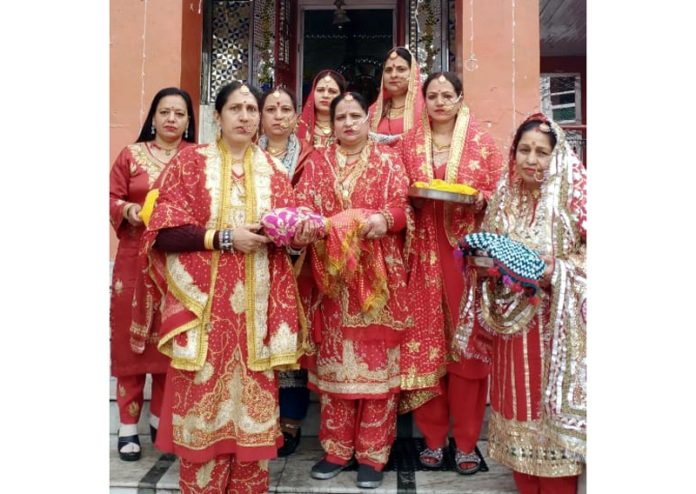Women dressed in bridal attire during the celebrations of Kanchoth Festival in Bhaderwah on Saturday.