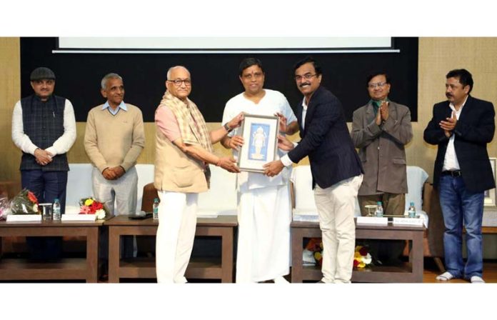 Acharya Balkrishna being felicitated by the Prof S K Khandel during a function on Sunday. Acharya Balkrishna being felicitated by the Prof S K Khandel during a function on Sunday.