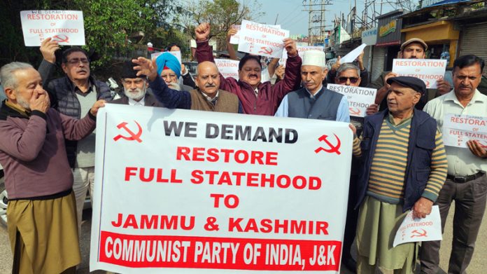 Activists and leaders of CPI (J&K) protesting at Jammu for restoration of Statehood. Activists and leaders of CPI (J&K) protesting at Jammu for restoration of Statehood.