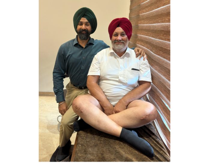 Dr Ranjit Singh along with his patient after performing his knee replacement surgery.