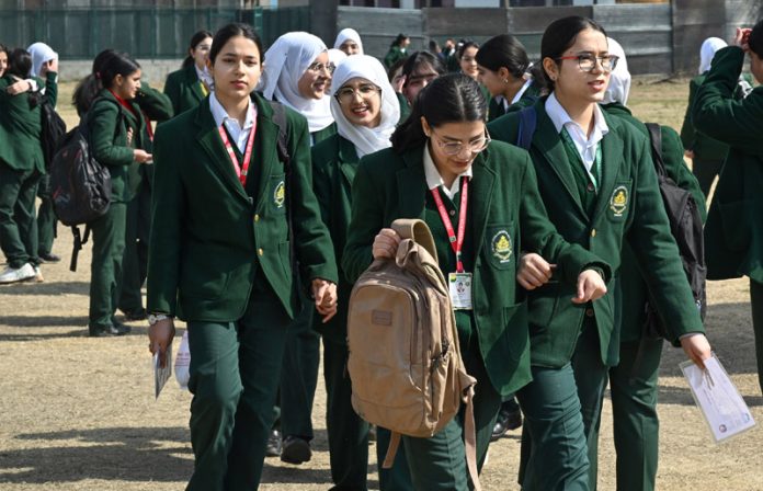 Students heading towards their exam centre in Srinagar as class 10 examinations begin on Monday. -Excelsior/Shakeel
