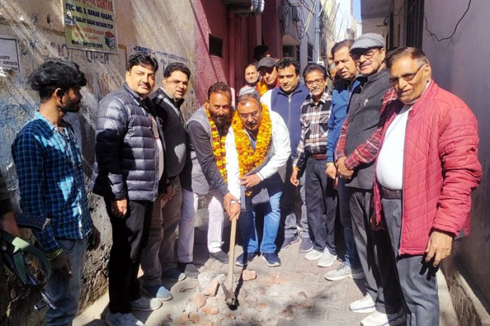 MLA Vikram Randhawa starting lane-drain work in Nanak Nagar on Friday.
