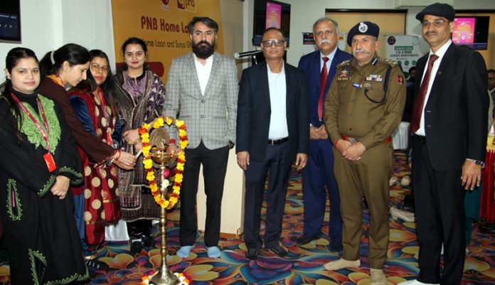 DIG JSK Range Shiv Kumar Sharma along with PNB executives during Home Loan Expo at Bahu Plaza, Jammu. -Excelsior/Rakesh