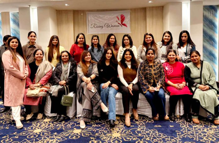 Aarti Mahajan along with other women posing for a photograph during a function on Monday.