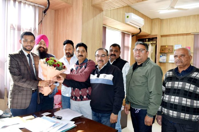 Members of JNEA delegation presenting a bouquet to Director Information J&K Nitish Rajora in Jammu.