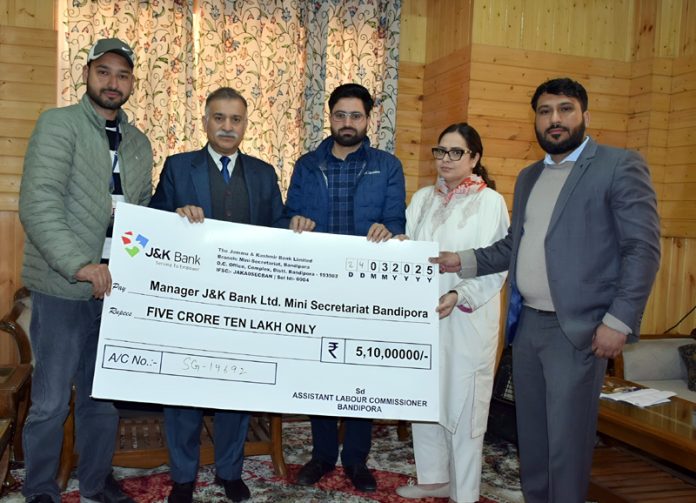 DC Bandipora hands over 5.10 crore check for payment under Education Assistance Scheme copy