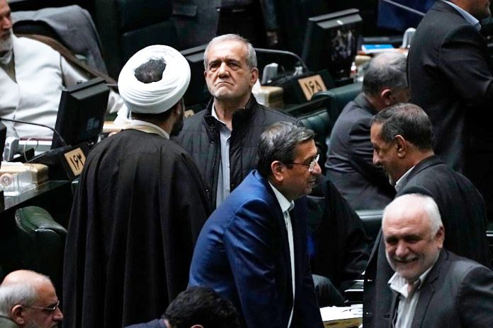 Iran's Parliament fires minister of economy over plummeting rial, mismanagement Iran's Parliament fires minister of economy over plummeting rial, mismanagement
