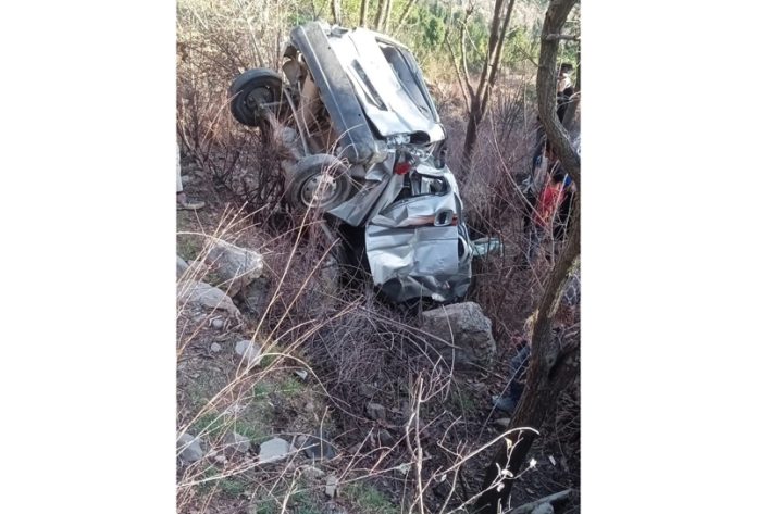 Mingled remains of car which fell into a gorge in Doda on Saturday.