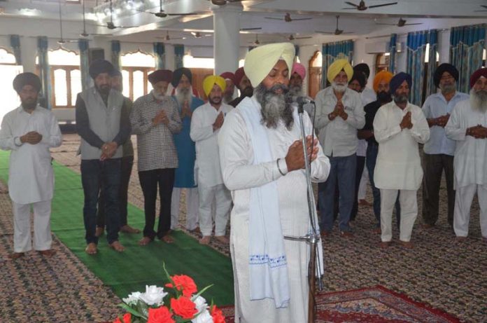Sikh Sangat during a Sehaj Path Samagam at Kathua on Saturday.