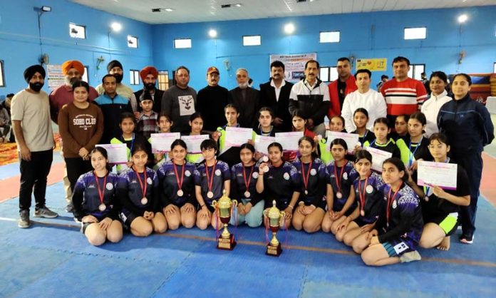 Winning team posing with their trophies after a spectacular victory