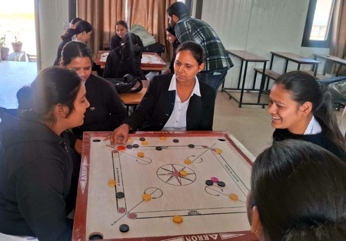Players displaying keen interest during an exciting carrom match at GCW Bhagwati Nagar, Jammu.