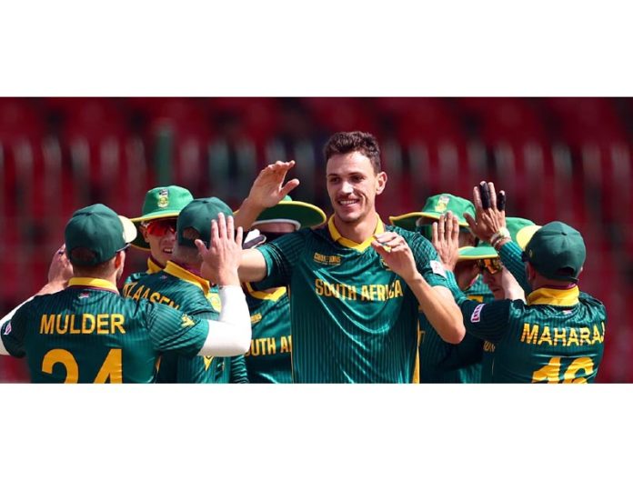 South African players celebrating after defeating England at Karachi on Saturday.