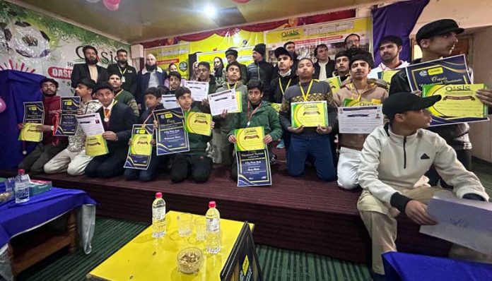 Junior National Shooting Ball team posing with certificates.