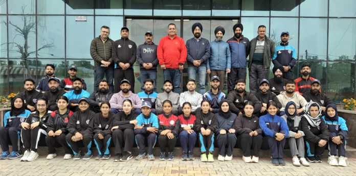 Selected Softball players posing for a group photograph.