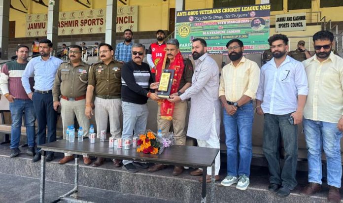 Memento being presented to dignitary during the ongoing Anti-Drug Cricket League at MA Stadium, Jammu.