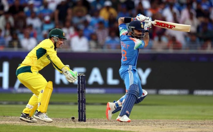 Virat Kohli playing a brilliant cover drive during his inning of 84 runs against Australia in Dubai on Tuesday. Virat Kohli playing a brilliant cover drive during his inning of 84 runs against Australia in Dubai on Tuesday.