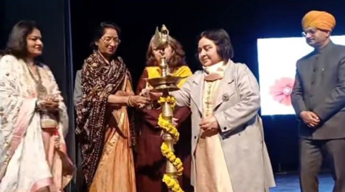 Dignitary lighting traditional lamp during the 