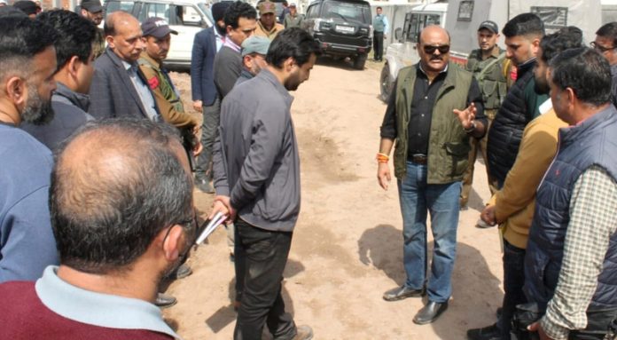 Dy CM Surinder Choudhary interacting with locals after laying foundation stone in Kunjwani area.