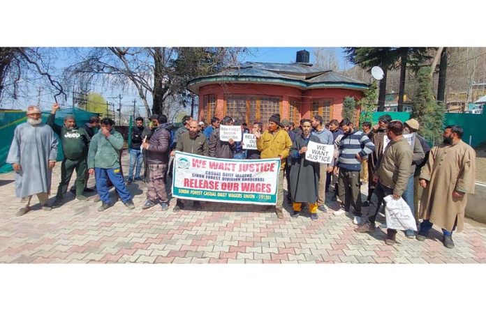 Casual labourers of Forest Division Ganderbal staging protest on Monday. -Excelsior/Firdous Ahmad