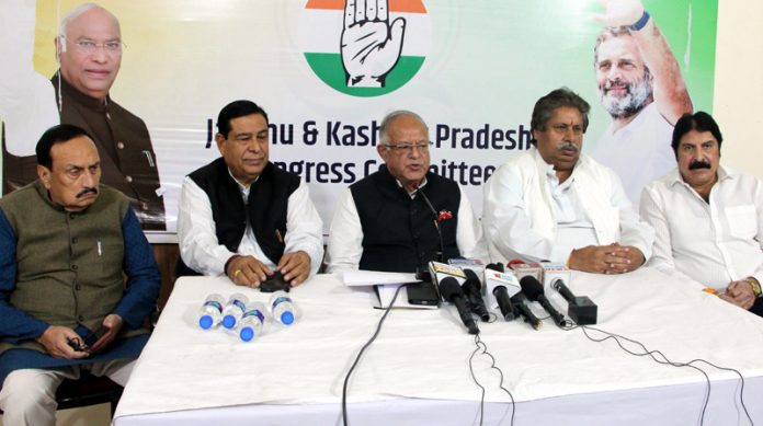 JKPCC chief T H Karra along with Raman Bhalla, Ravinder Sharma & others during press conference in Jammu. -Excelsior/Rakesh