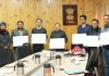 Chief Secy Dr Pawan Kotwal & others releasing annual calendar during a function at Leh on Wednesday.