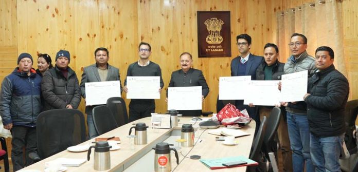 Chief Secy Dr Pawan Kotwal & others releasing annual calendar during a function at Leh on Wednesday. Chief Secy Dr Pawan Kotwal & others releasing annual calendar during a function at Leh on Wednesday.