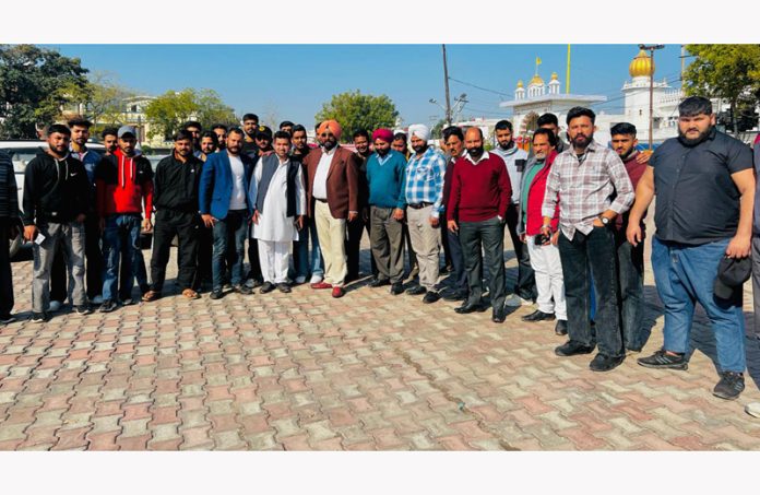 Senior Congress leader, Taranjit Singh Tony, posing with unemployed youth in Jammu.
