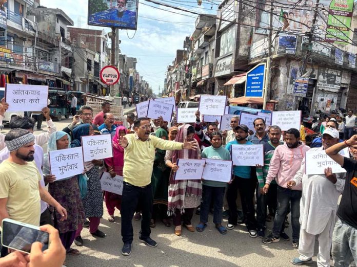 Cong activists staging protest at Vijaypur in Samba on Wednesday. Cong activists staging protest at Vijaypur in Samba on Wednesday.