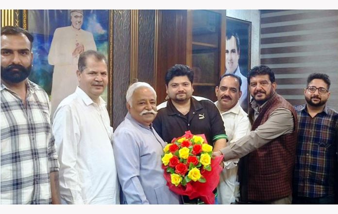 A delegation of youth during meeting with senior NC leader, Ajay Sadhotra at party office in Jammu on Wednesday.