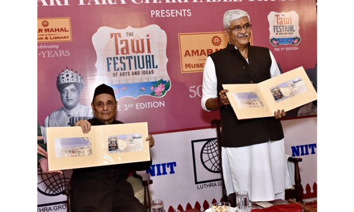 Union Minister Gajendra Singh Shekhawat and Dr Karan Singh release a souvenir during concluding day of Tawi Festival-3, at Amar Mahal Palace, Jammu on Sunday.
