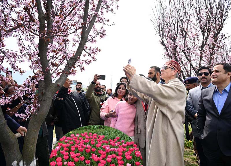 CM Omar Abdullah capturing a picture at Tulip Garden.