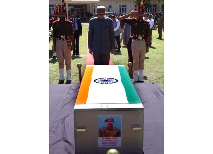CM Omar Abdullah paying last respects to police martyr at Gulshan Ground, Jammu on Saturday. -Excelsior/Rakesh CM Omar Abdullah paying last respects to police martyr at Gulshan Ground, Jammu on Saturday. -Excelsior/Rakesh
