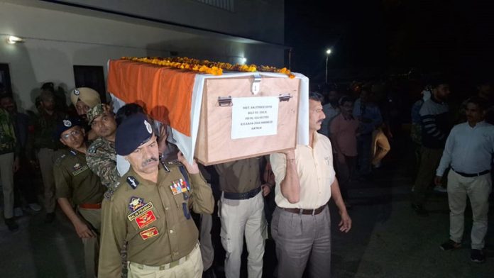 DGP Nalin Prabhat lends shoulder to a martyr at DPL Kathua. — Excelsior/Pradeep