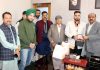 Deputy Chief Minister Surinder Choudhary felicitating 38th National Games Bronze medallist, Judo player Rajat Singh Chib in Jammu.