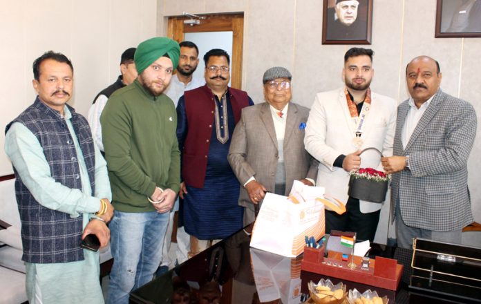 Deputy Chief Minister Surinder Choudhary felicitating 38th National Games Bronze medallist, Judo player Rajat Singh Chib in Jammu. Deputy Chief Minister Surinder Choudhary felicitating 38th National Games Bronze medallist, Judo player Rajat Singh Chib in Jammu.