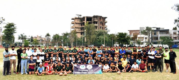 Rugby players posing along with dignitaries during district championship at Jammu.