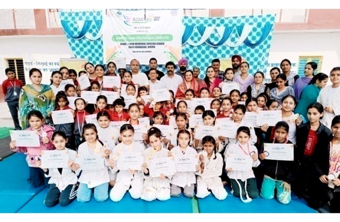 Judo players posing along with certificates. Judo players posing along with certificates.