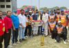 Dignitaries presenting a cheque to winning team during prize distribution ceremony of Anti-Drug Veteran Cricket League.
